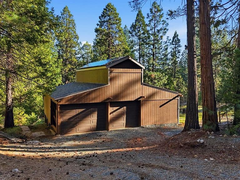 The gathering barn among the pines